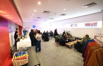 A photograph of visitors in the Tate Liverpool + RIBA North cafe