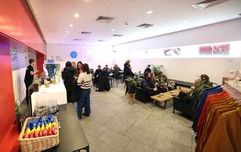 A photograph of visitors in the Tate Liverpool + RIBA North cafe