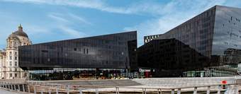 Two modern black buildings and the word 'Discover' written above the door.