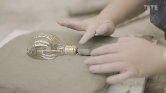 Clay stopper at base of lightbulb